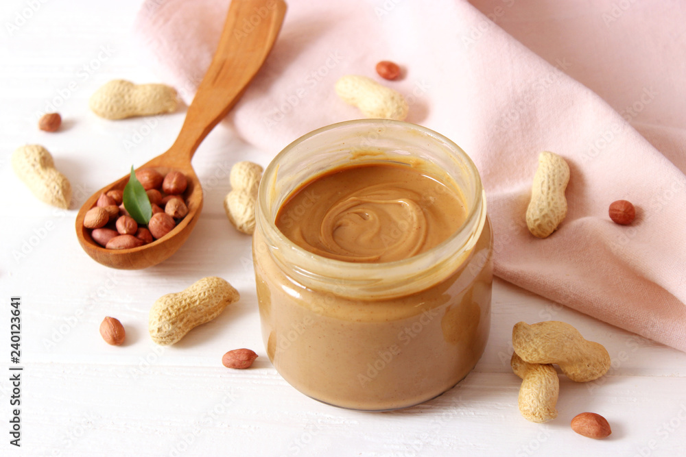 peanut butter and peanut beans on wooden background peanut butter and peanut beans on wooden background