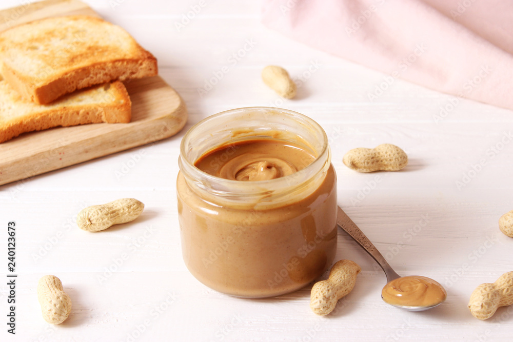 peanut butter and peanut beans on wooden background peanut butter and peanut beans on wooden background
