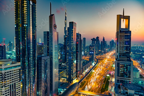 Beautiful skyline with skyscrapers at night during blue hour in Dubai © adammachowiak