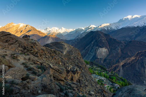 Scenic view of Hunza Valley in summer between the Karakoram Mountain range in Pakistan in the morning.