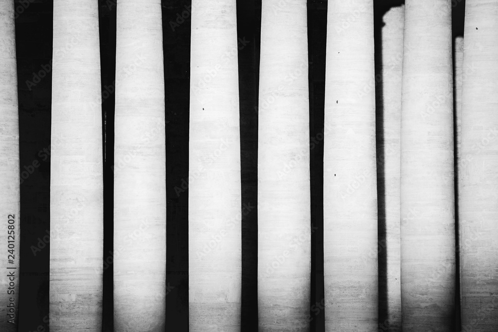 A fine art shot of Columns in Saint Peter Square, near the Basilica of Saint Peter in Rome, Italy A fine art shot of Columns in Saint Peter Square, near the Basilica of Saint Peter in Rome, Italy