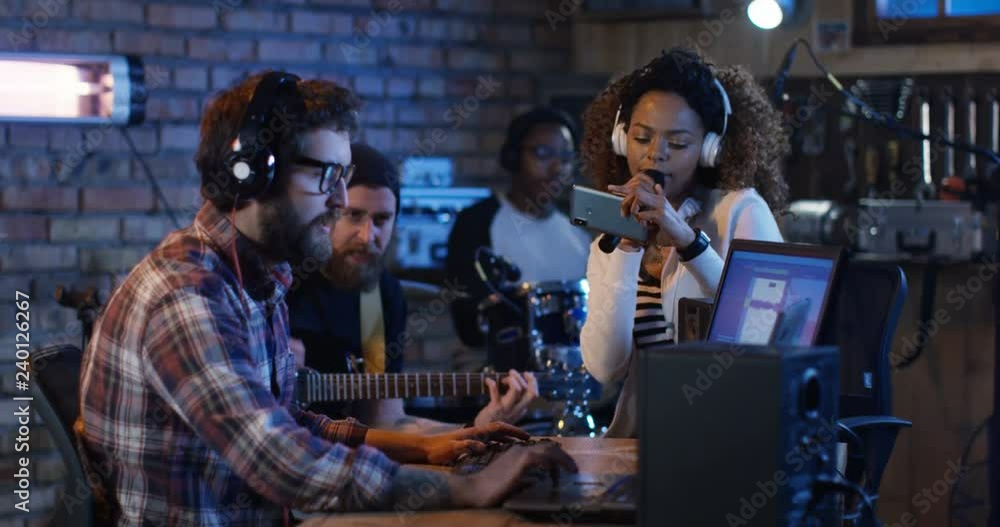 Musicians arrange the song and record it at home in the garage. Musicians arrange the song and record it at home in the garage.