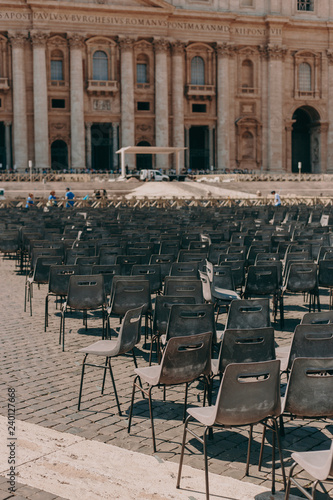 St. Peter's Square in the Vatican on a sunny day. Architecture and many chairs © alexbutko_com