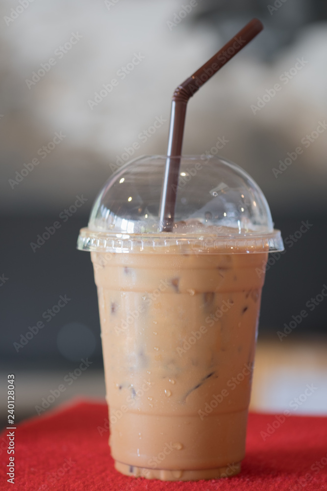 Cup of iced mocha coffee on red table background. Cup of iced mocha coffee on red table background.