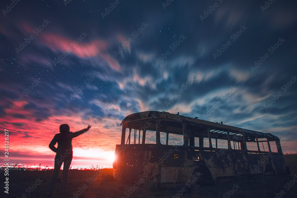 Landscape with blue sky and yellow light. Girl looking at the night city. Landscape with blue sky and yellow light. Girl looking at the night city.