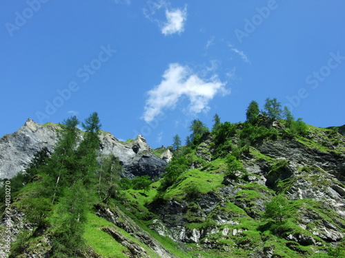 Mountains and rocks in the valley Weisstannenthal - Canton of St. Gallen, Switzerland photo