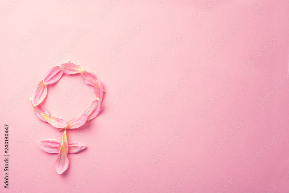 Gender Venus symbol made of beautiful flower petals on candy pink background, copy space for text Gender Venus symbol made of beautiful flower petals on candy pink background, copy space for text