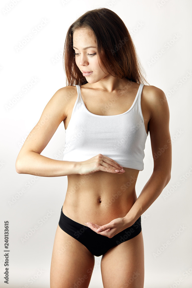 Obraz premium close up photo. fit girl showing her ideal waste. willingness, motivation