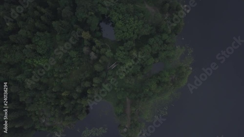 Aerial survey epic forest panoramas in Vyborg, Mon Repos park. Monrepos north epic coniferous forest panoramas footage. Top down view rocky island. aerial video coniferous tree and island the dead. photo