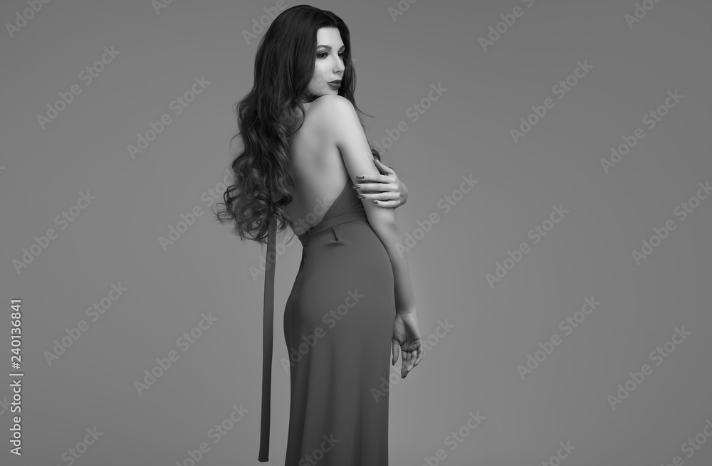Gorgeous young brunette woman with curly hair in red dress Gorgeous young brunette woman with curly hair in red dress