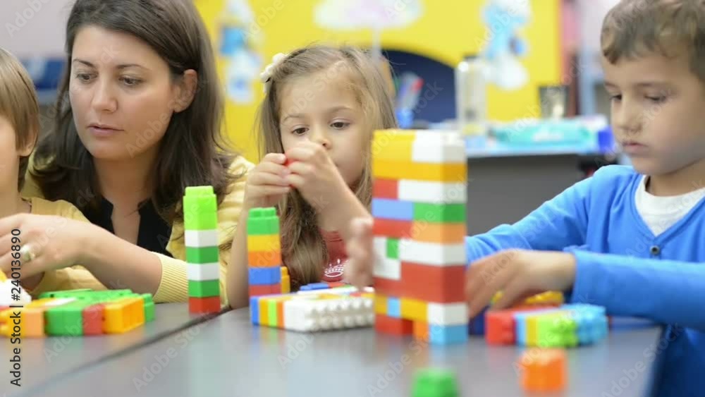 Kids and Educator Playing at Kindergarten Kids and Educator Playing at Kindergarten
