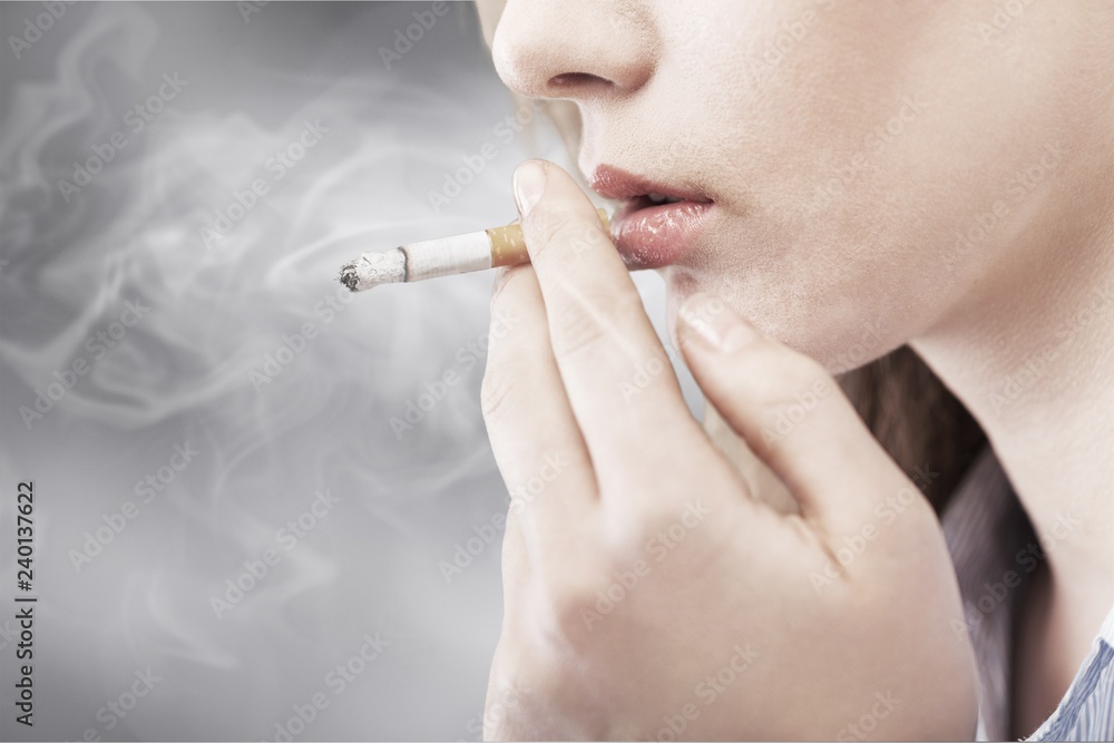 Portrait of the young elegant girl smoking cigarette isolated Portrait of the young elegant girl smoking cigarette isolated