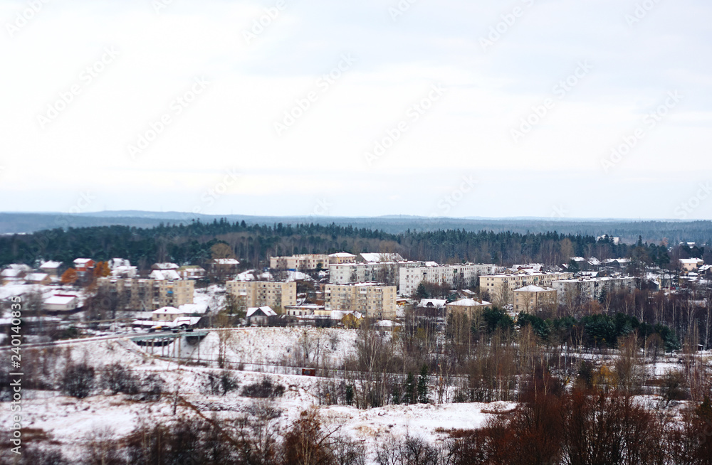 a quiet, nondescript town in the middle of the forest in winter