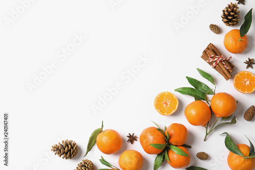Christmas composition with ripe tangerines and space for text on white background, flat lay