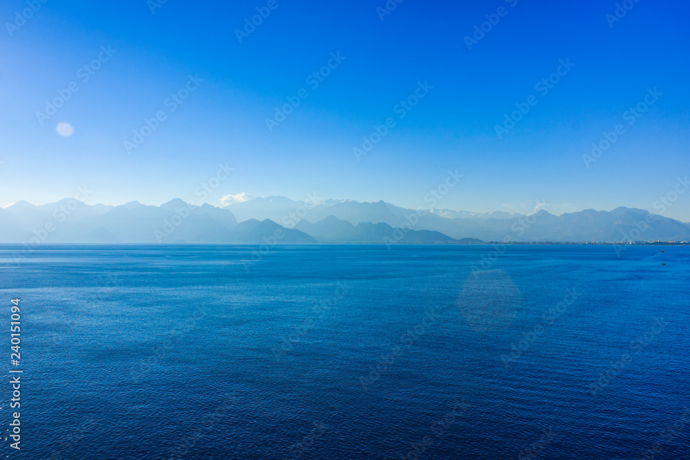 Calm blue Mediterranean sea and mountains in Antalya