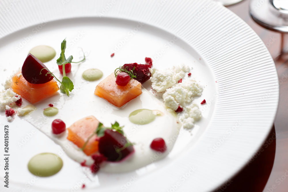 Salmon served in a restaurant specializing in molecular cuisine Salmon served in a restaurant specializing in molecular cuisine