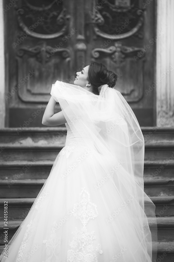 Beautiful european bride walking near old castle and have fun Beautiful european bride walking near old castle and have fun