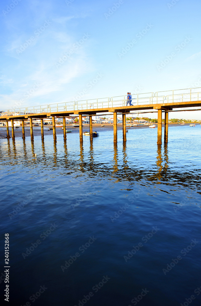 Footbridge of the pier in the fishing port of El Rompido, beaches of Huelva, Andalusia, Spain
