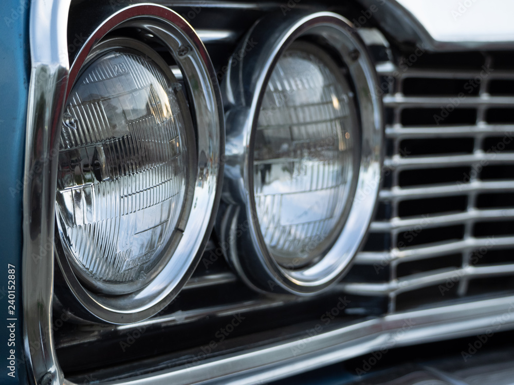 close up old classic car headlights