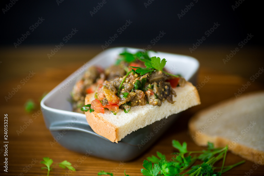 eggplant caviar with tomatoes and a slice of bread eggplant caviar with tomatoes and a slice of bread