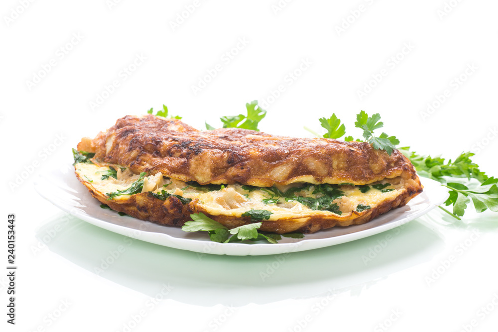 fried omelet with cauliflower and greens in a plate fried omelet with cauliflower and greens in a plate