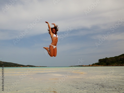 Girl jumping on the beach