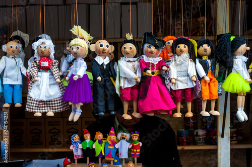 Multicolored handmade dolls. Close-up. Showcase at the fair