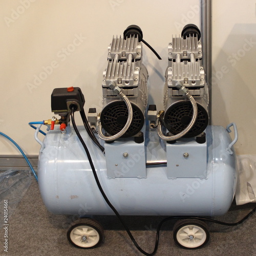 Obraz na płótnie Two motor electric air compressor with 50 l gray receiver tank w salonie