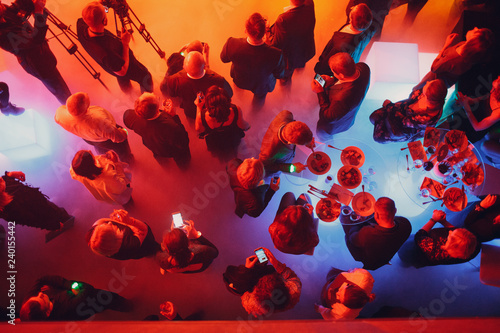 Sticker Party and corporate concept. People crowd at the tables top view.