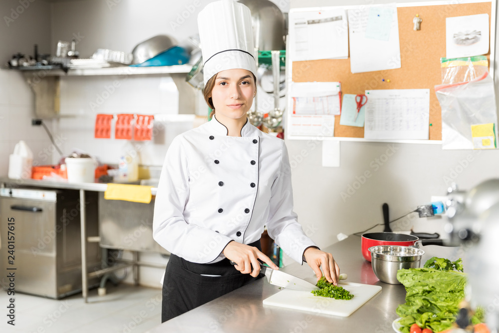 Confident Cook Chopping Vegetable In Kitchen Confident Cook Chopping Vegetable In Kitchen