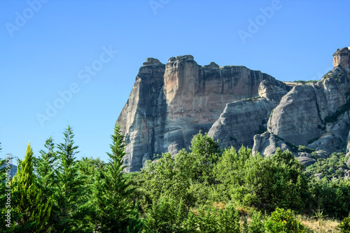 Beautiful view of rock between trees and bushes. Meteora, Greece.