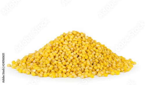 A heap of millet close-up on a white. Isolated. photo