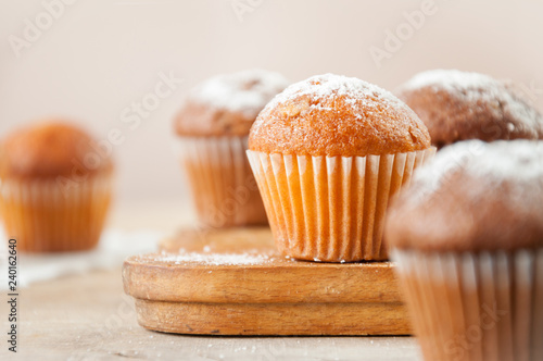 Fotografia Tasty muffin closeup on a wooden board, selective focus.