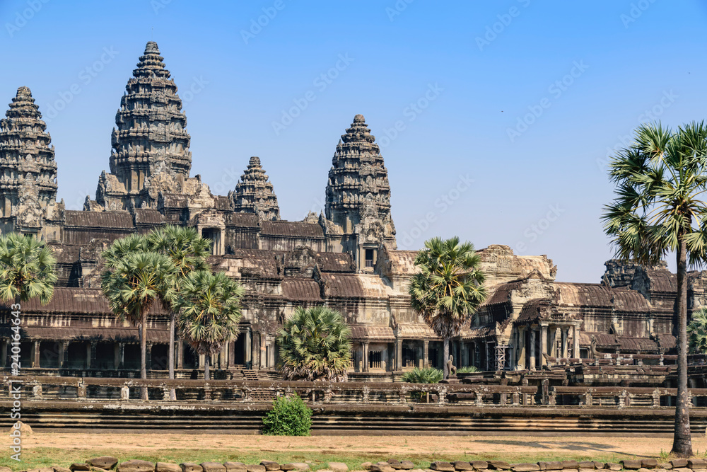 View of the main temple at Angkor wat. Originally constructed in the early 12th century, the ruins are a huge tourist attraction as well as a place of worship today