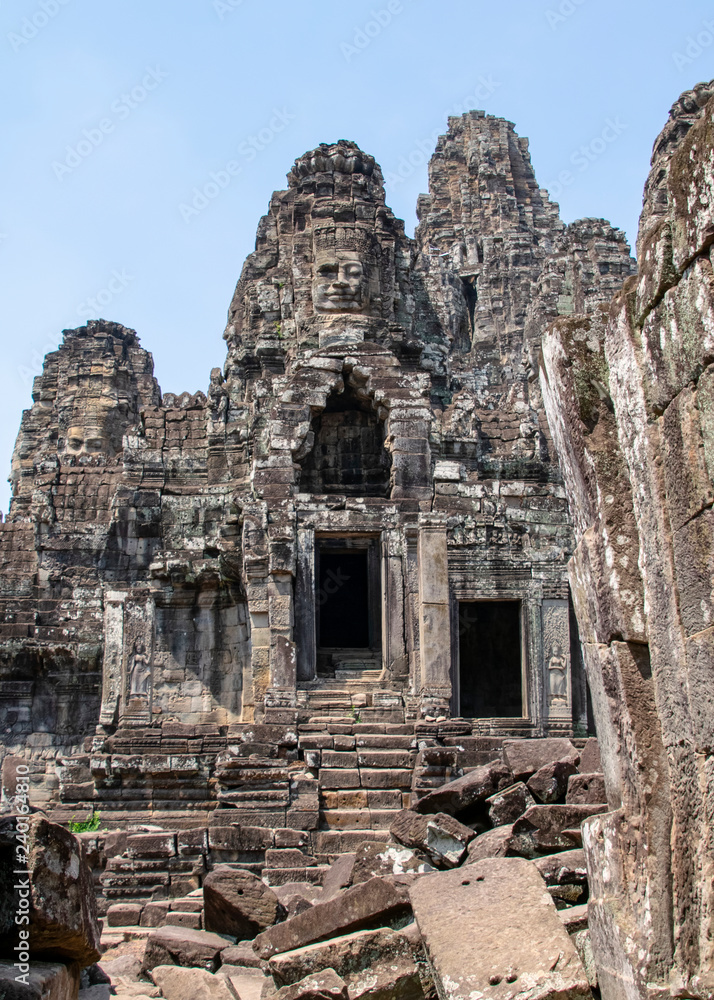 The Bayon temple is completely decorated. This patterned column has weathered and now moss picks out the finer details.