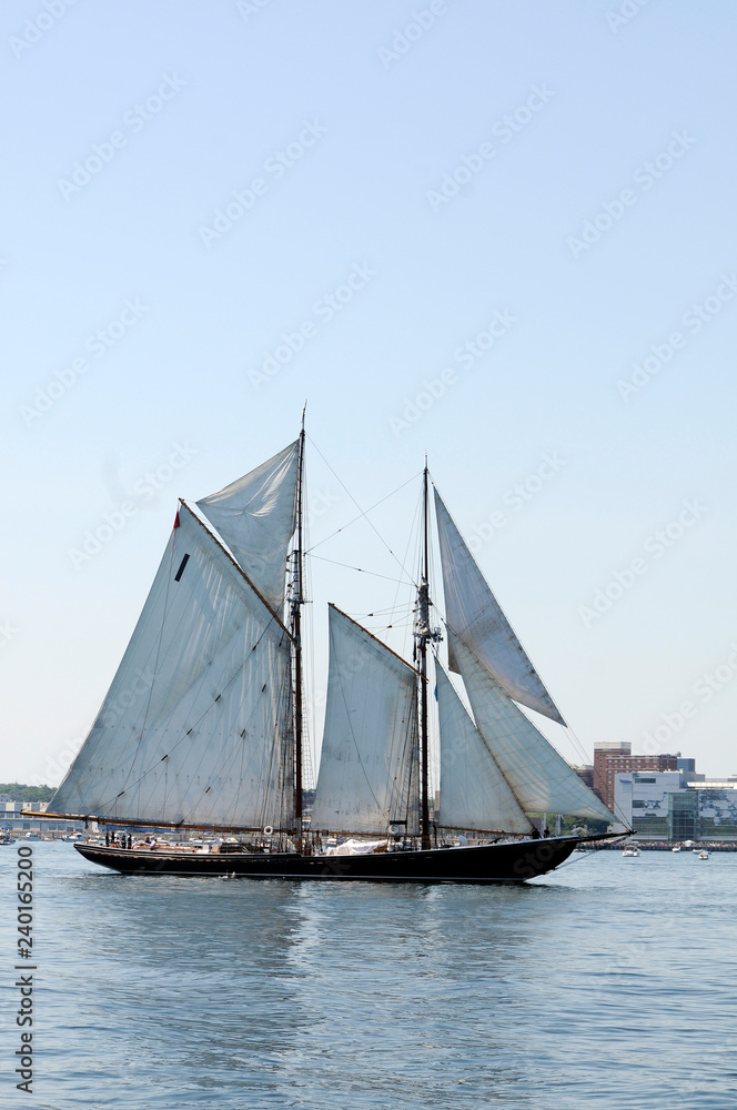 Tall Ship Sails Past Under Blue Sky