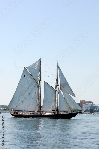 Tall Ship Sails Past Under Blue Sky