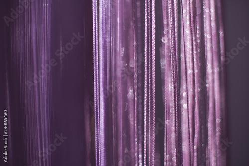 Purple-pink background with glitter at at dawn the sun. Background