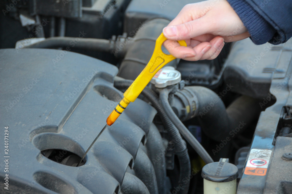 Checking the oil level from a car Checking the oil level from a car