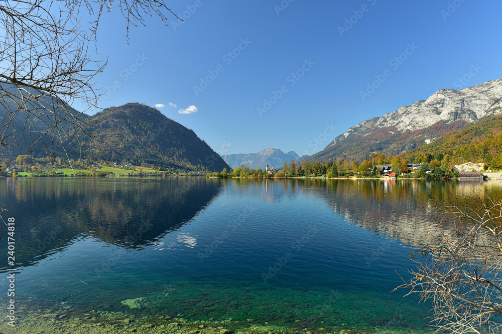 View of the lake Grundlsee in the early autumn morning, framed by the mountain range Totes Gebirge. Styria, Austria.