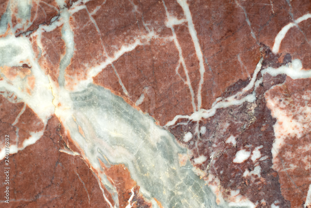 red marble with white splashes. marble texture with natural pattern for background or design