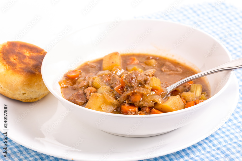 Bright Backlight on Bowl of Beef Stew and Biscuit Bright Backlight on Bowl of Beef Stew and Biscuit