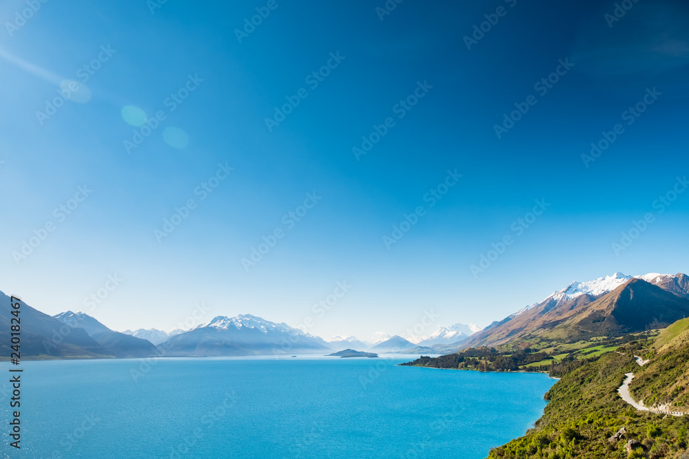 Beautiful landscape of Lake Wakatipu and Alps mountain with blue sky.