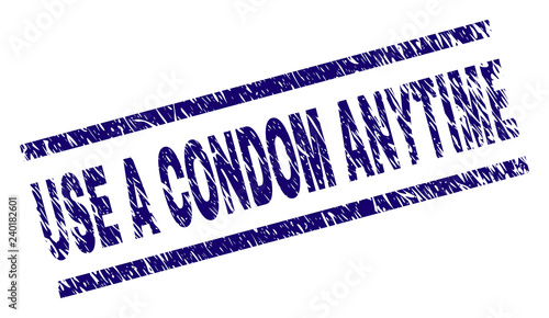 USE A CONDOM ANYTIME seal print with grunge style. Blue vector rubber print of USE A CONDOM ANYTIME label with grunge texture. Text caption is placed between parallel lines.