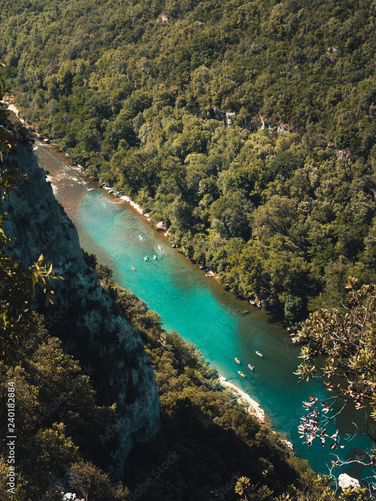 Top view on the Ardeche with numerous canoes