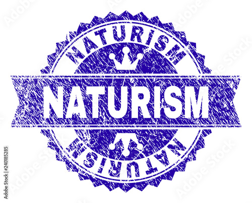 NATURISM rosette stamp seal watermark with grunge style. Designed with round rosette, ribbon and small crowns. Blue vector rubber watermark of NATURISM text with grunge style.