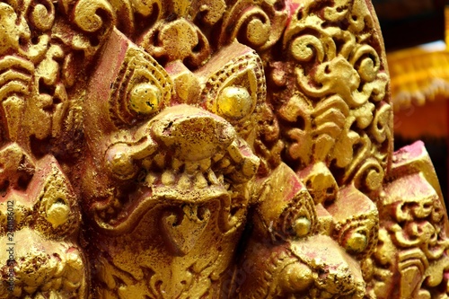 golden snake statue in cambodian temple