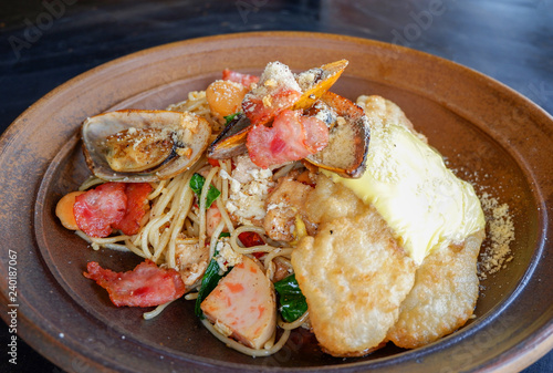 spaghetti cabonara plate / fresh spaghetti pasta with seafood fish mussel bacon and egg Italian pasta