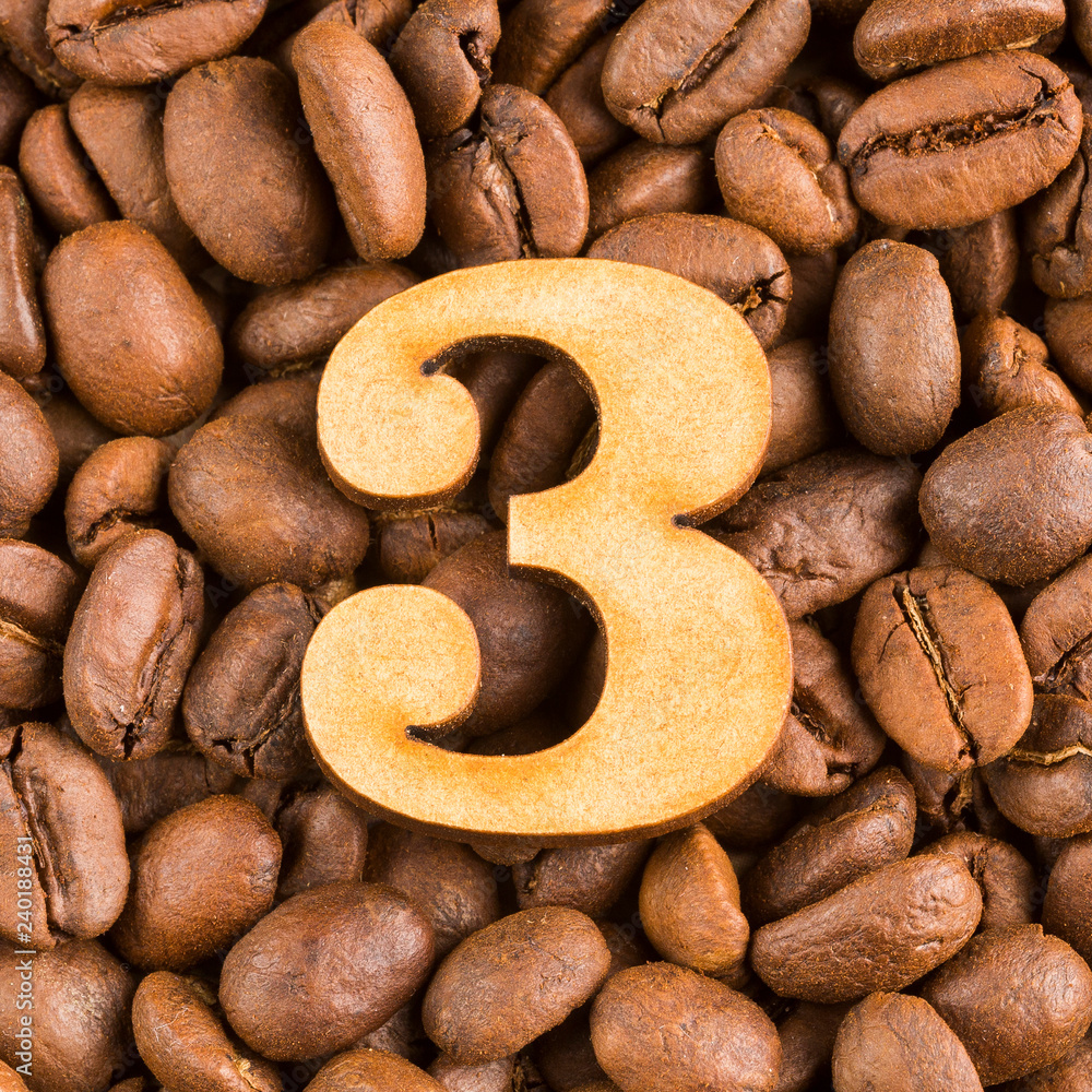 Fototapeta premium 3, Number on wood- background of coffee beans.