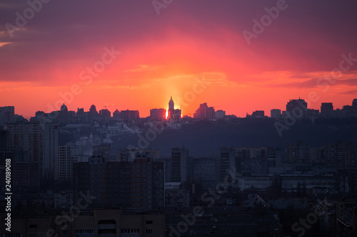 Sunset in Kiev  evening view of the panorama of the city  the church and the statue of the Motherland.  Evening color urban landscape